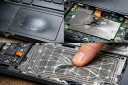 Common touchpad failure modes in heavily used laptops (worn surface, flex damage)