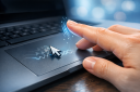 Why does cursor jitter when I lift my finger quickly off the touchpad?